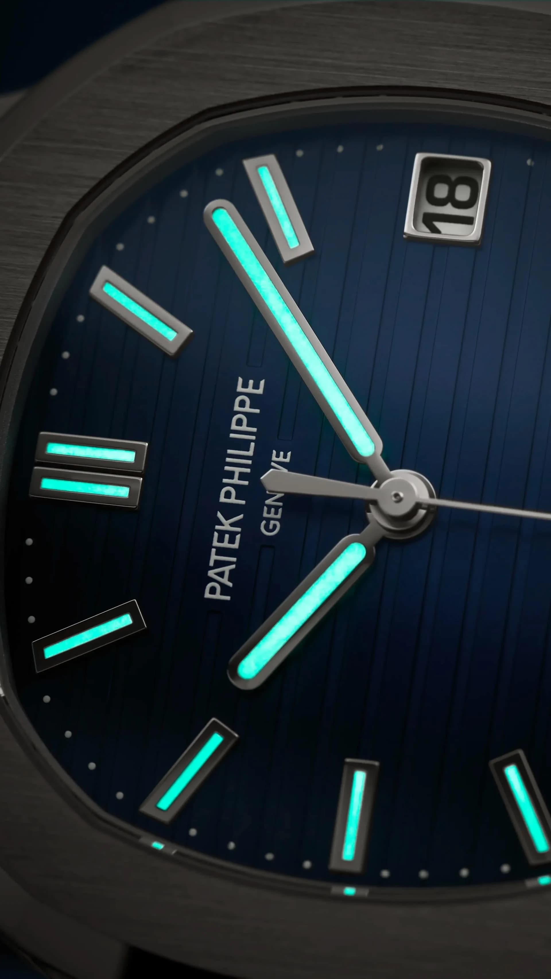 esfera azul de reloj Patek Philippe con índices luminiscentes en turquesa y ventana de fecha a las 3