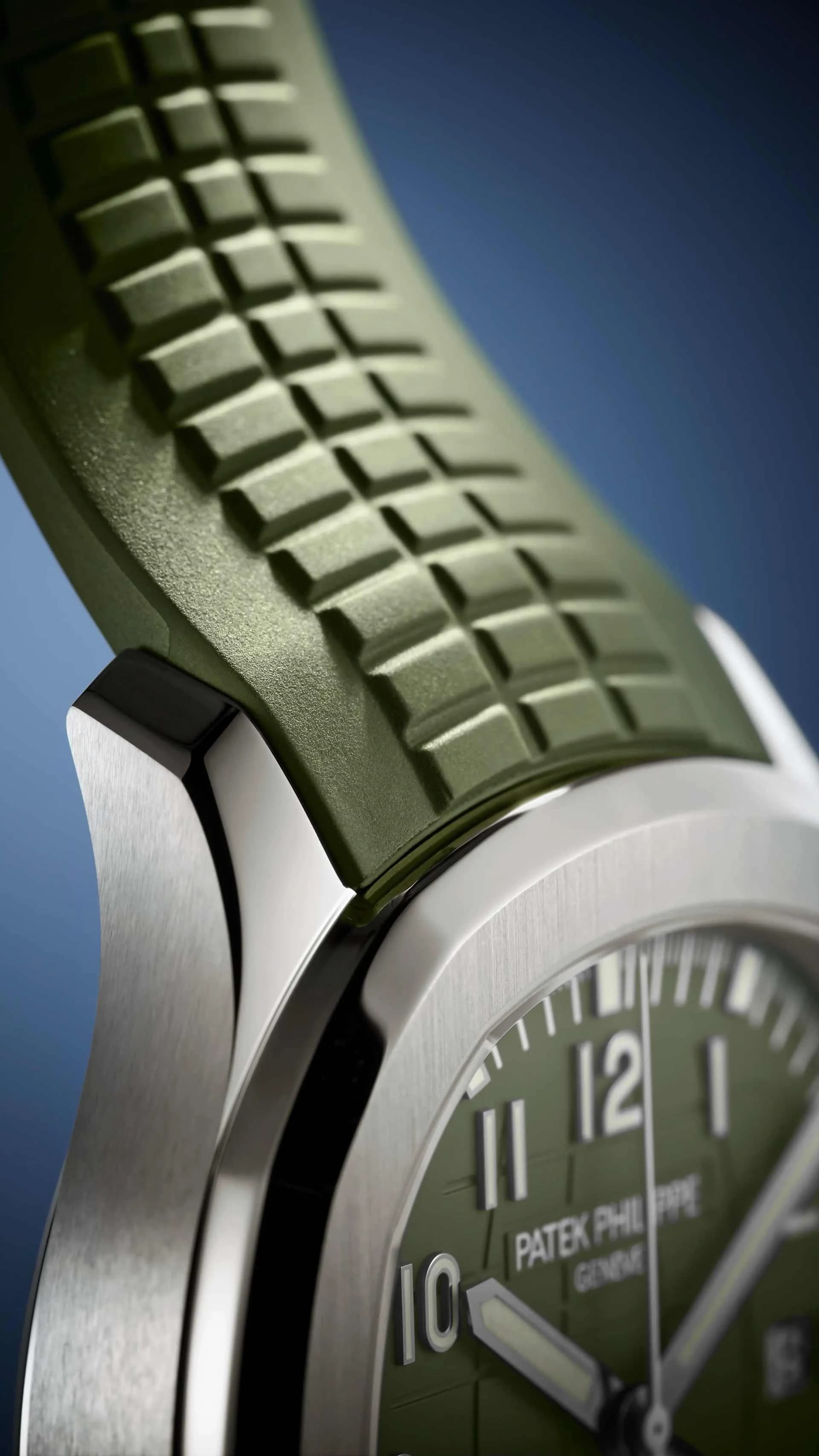 macro del enlace entre el brazalete de caucho verde con textura de cuadrícula y la caja de acero de un reloj Patek Philippe con esfera verde
