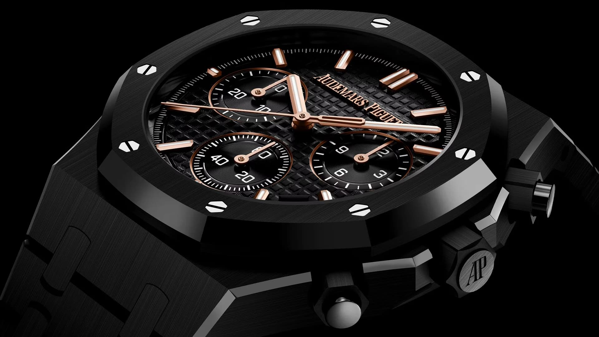 reloj cronógrafo negro con bisel octogonal, tres subesferas y agujas en tono dorado rosado